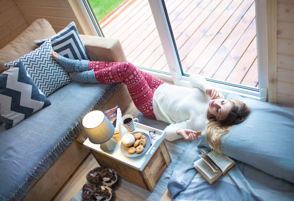 Woman posing for Instagram in apartment